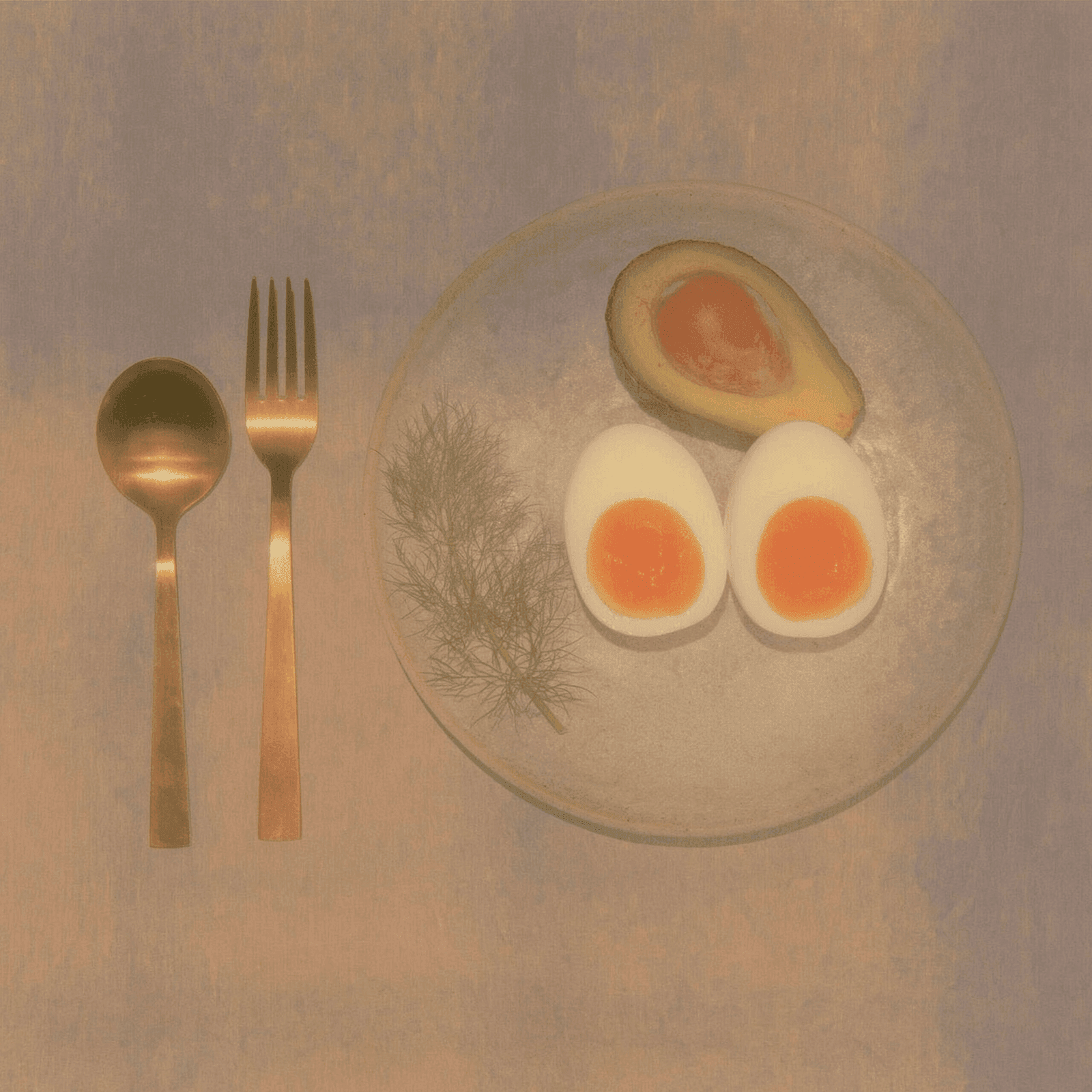 An overhead flatlay of a clean meal with avocado and eggs, evoking the food-focused scope of the Food Intolerance test