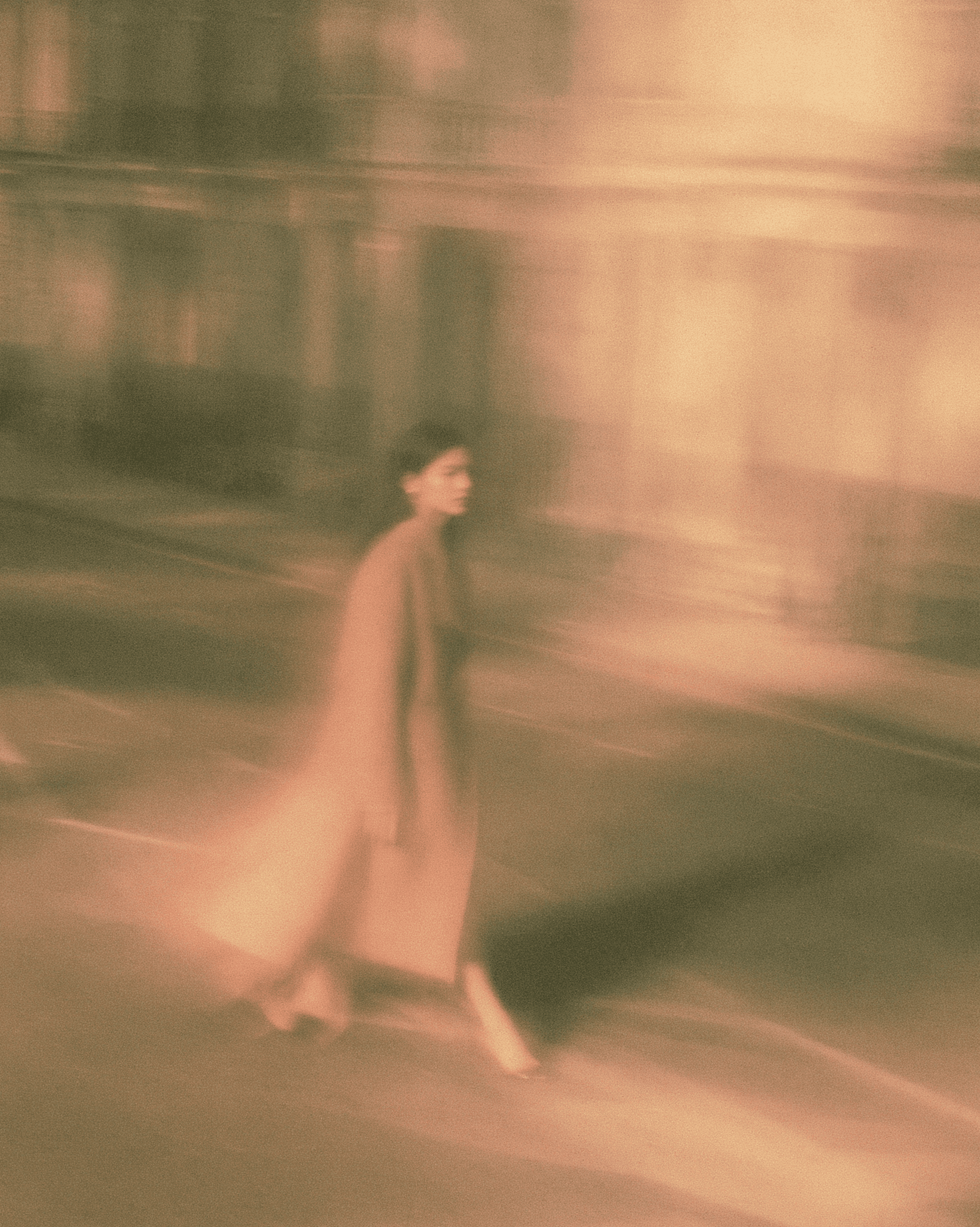 A woman walking alone along an empty Belgravia street, evoking the long, considered arc of gut health