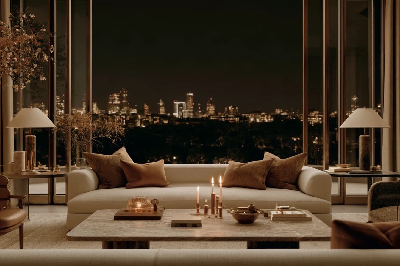 A lamplit sitting room at night, the city lit up beyond the window