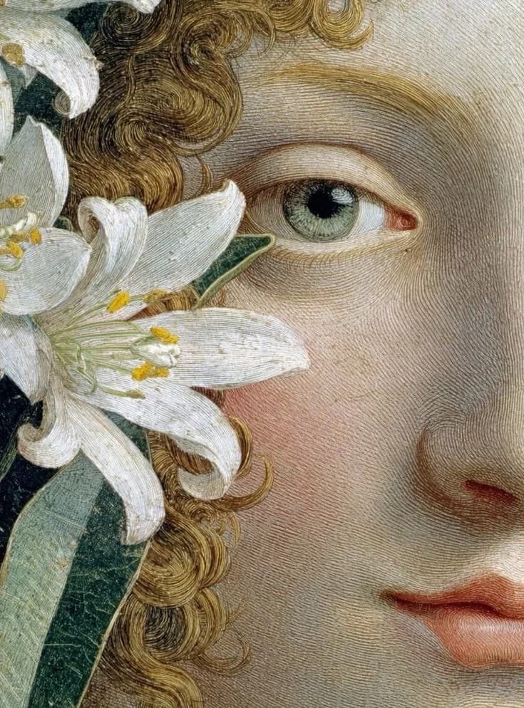 A painted face, a white lily held beside the eye