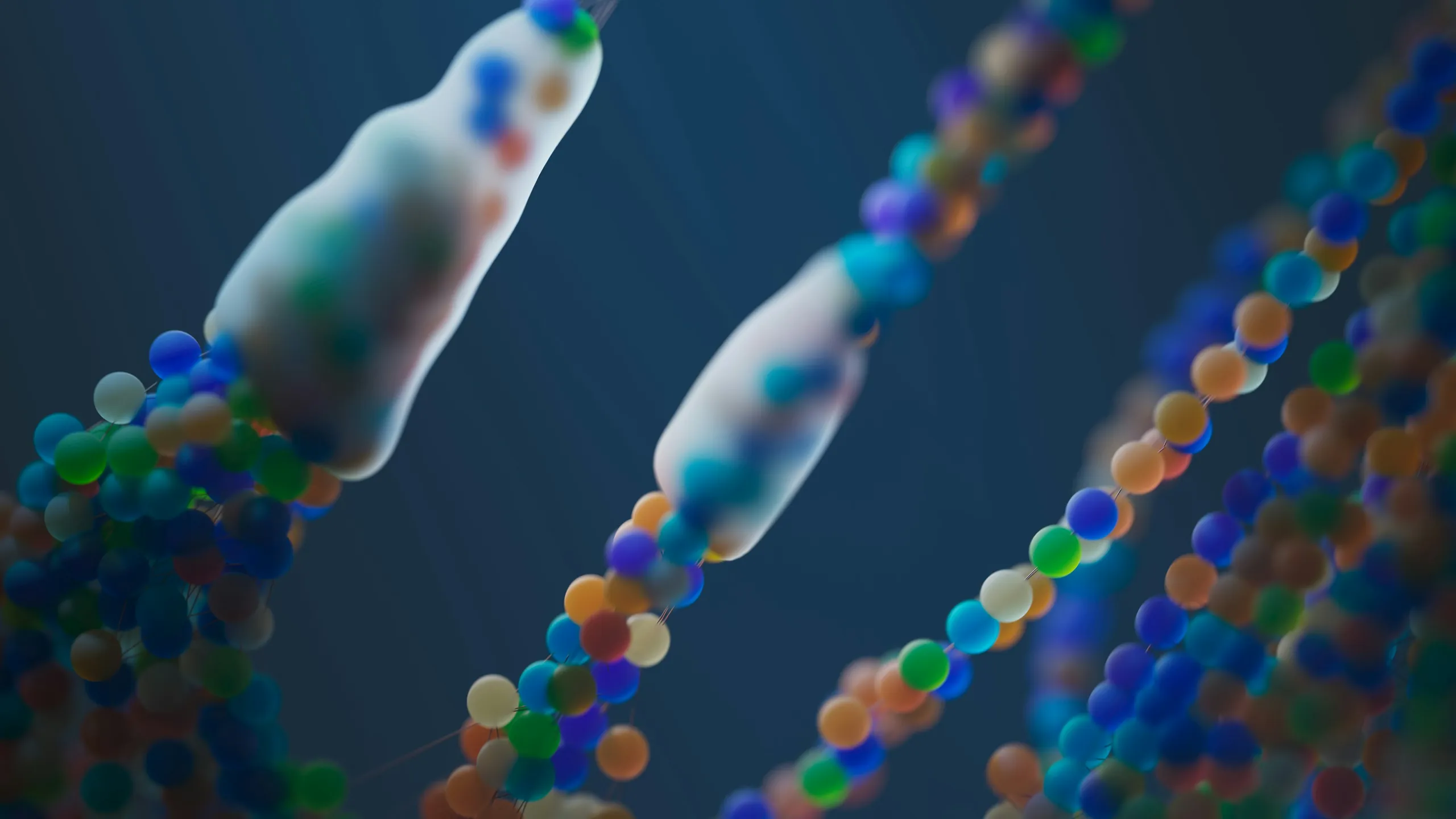 Strands of coloured beads folding against a deep blue ground, like a protein chain