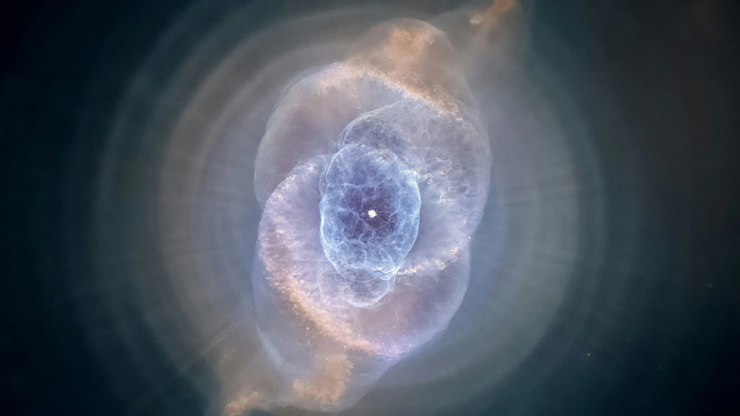 The Cat's Eye Nebula, shells of glowing gas around a dying star, photographed by Hubble