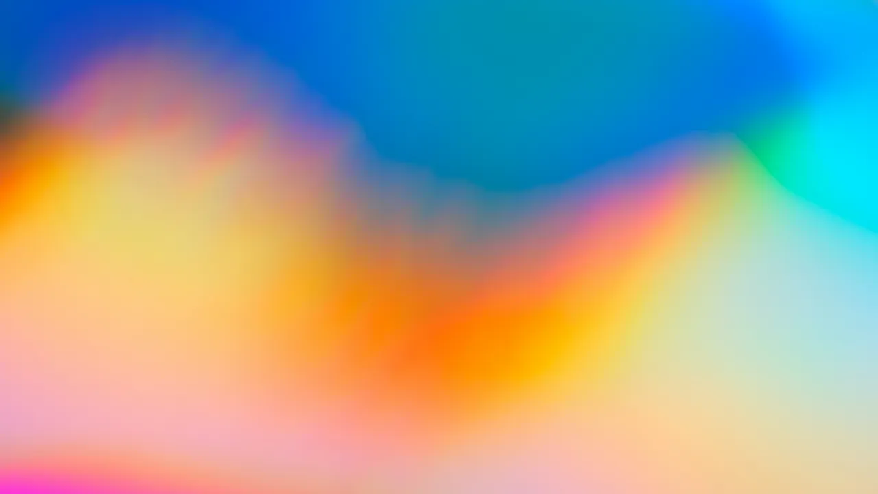Holographic light in orange, pink and blue, softly blurred