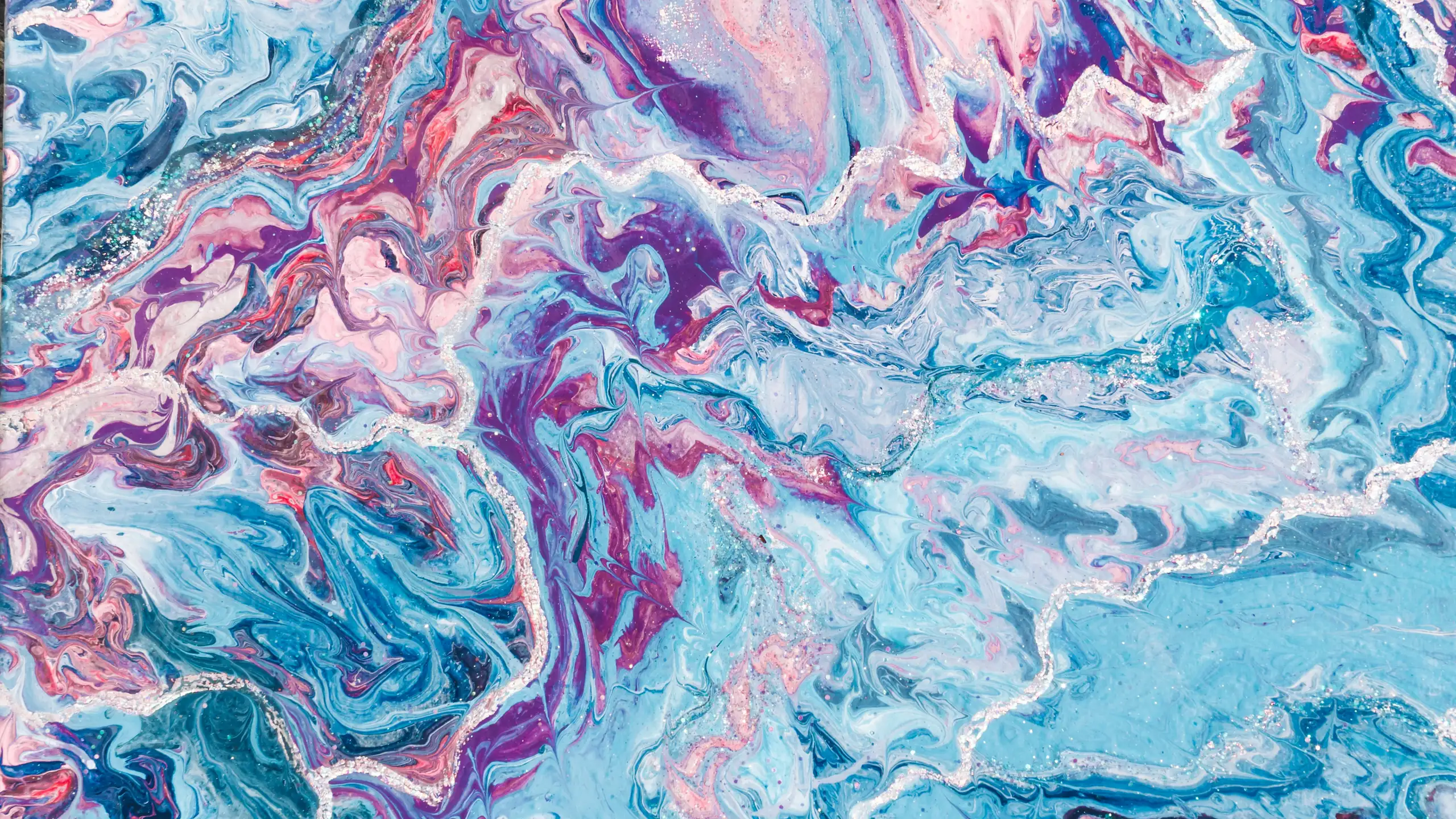 Poured paint marbled in pink, white and pale blue