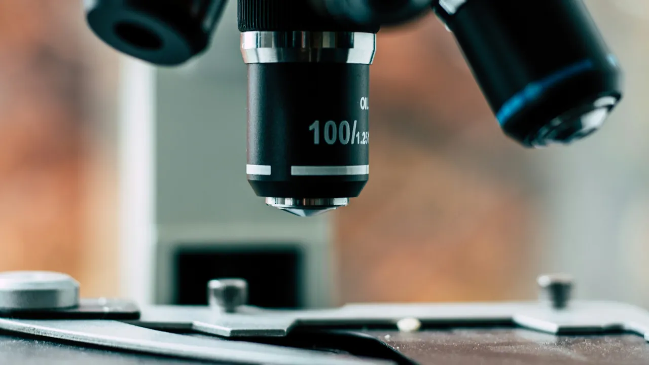 Close up of a laboratory microscope and its objective lenses