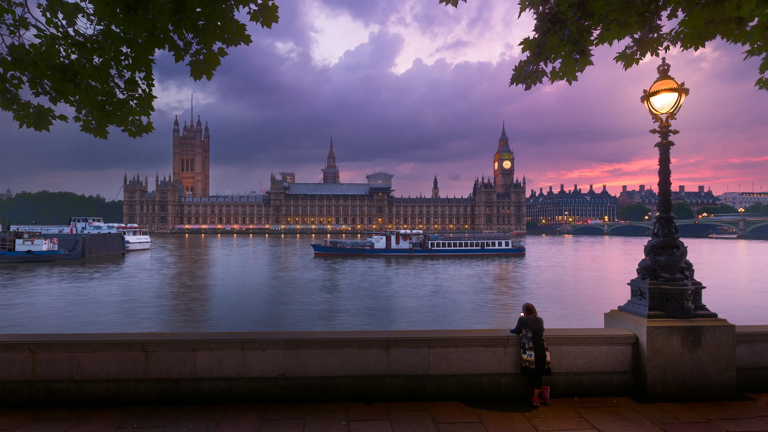 The Houses of Parliament across the Thames under a lilac evening sky, a lamp post in the foreground